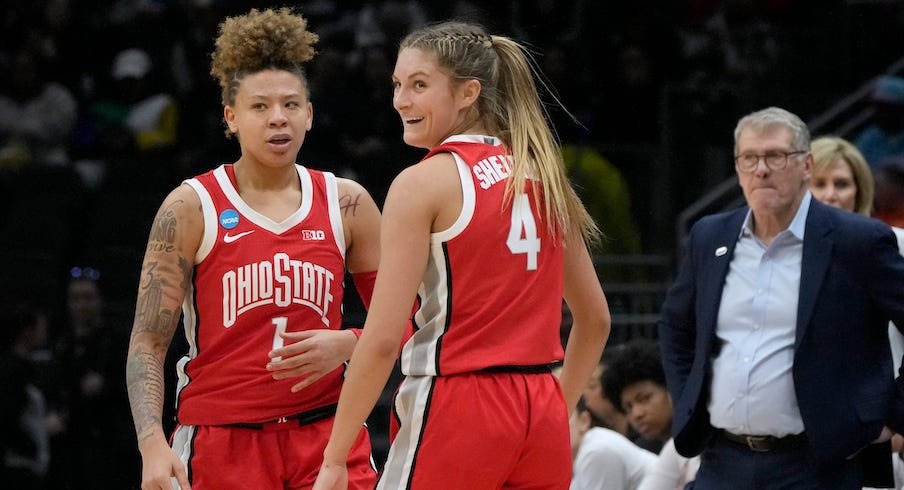 Rikki Harris and Jacy Sheldon celebrate Ohio State’s win in front of a sad Geno Auriemma.