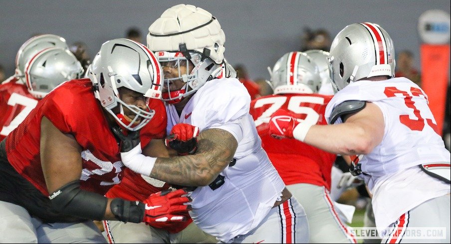 Tegra Tshabola and Carson Hinzman vs. Ohio State’s defensive line in practice