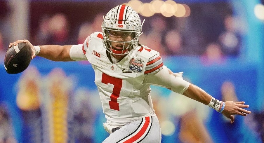 Dec 31, 2022; Atlanta, Georgia, USA; Ohio State Buckeyes quarterback C.J. Stroud (7) evades pressure from the Georgia Bulldogs during the second quarter of the 2022 Peach Bowl at Mercedes-Benz Stadium. Mandatory Credit: Dale Zanine-USA TODAY Sports