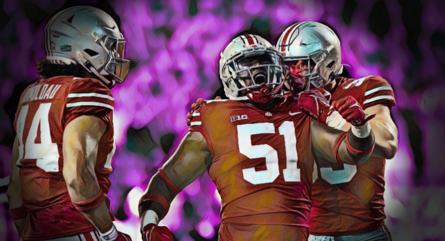 Sep 3, 2022; Columbus, Ohio, USA; Ohio State Buckeyes defensive end Jack Sawyer (33) and defensive end J.T. Tuimoloau (44) celebrate after a sack by defensive tackle Michael Hall Jr. (51) against the Notre Dame Fighting Irish during the fourth quarter at Ohio Stadium. Ohio State won 21-10. Mandatory Credit: Adam Cairns-USA TODAY Sports