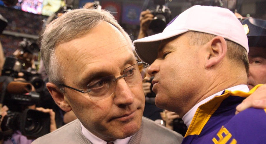 Jan 7, 2008; New Orleans, LA, USA; LSU Tigers head coach Les Miles shakes hands with Ohio State Buckeyes head coach Jim Tressel after the Tigers won the BCS National Championship game at the Louisiana Superdome. LSU defeated Ohio State 38-24. Mandatory Credit: John David Mercer-USA TODAY Sports