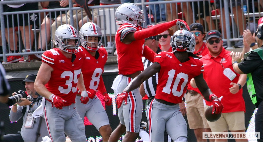 Denzel Burke celebrates his interception