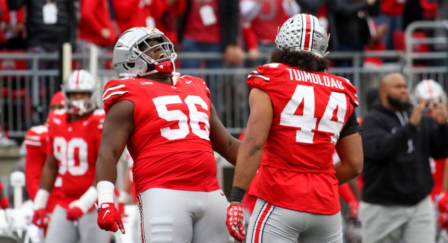 Ohio State players Kayden McDonald and J.T. Tuimoloau