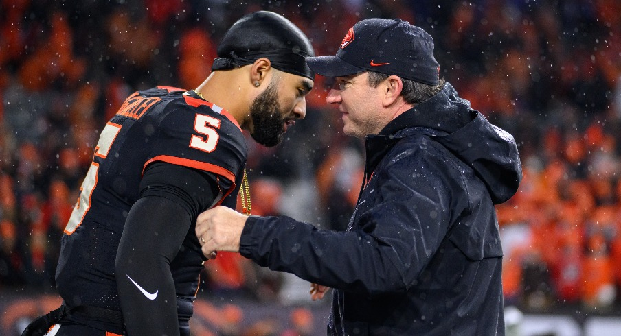 Former Oregon State head coach with Beavers quarterback D.J. Uiagalelei