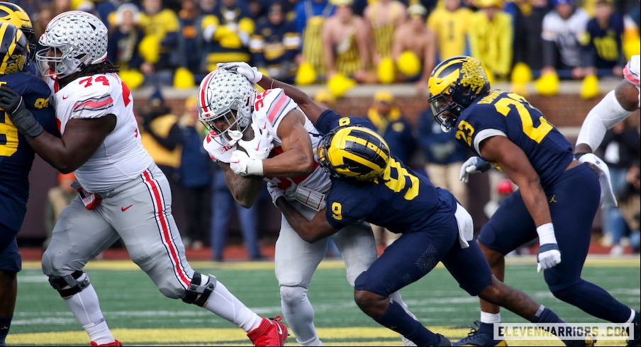 TreVeyon Henderson getting tackled vs. Michigan