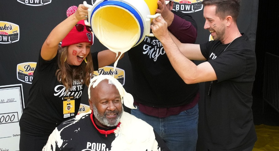 Mike Locksley celebrating the Mayo Bowl win