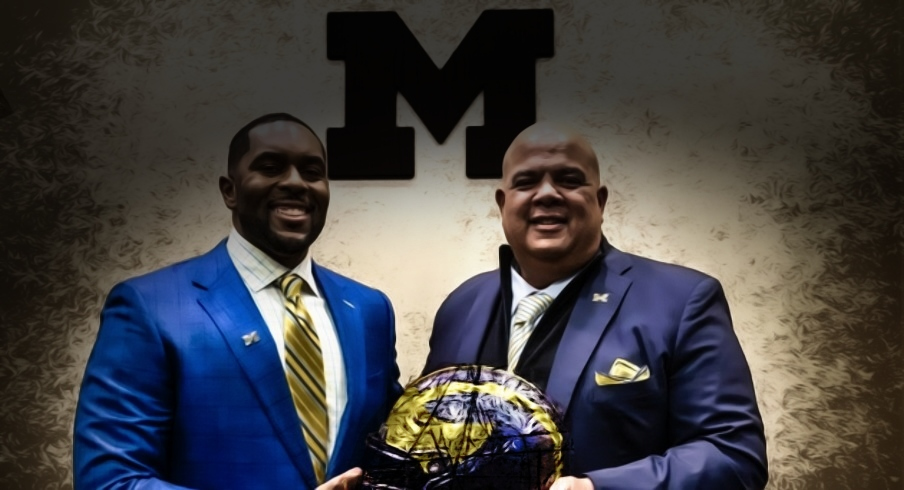 Sherrone Moore, head coach of the University of Michigan, stands next to Warde Manuel, Michigan s Director of Athletics, during a press conference inside the Junge Family Champions Center in Ann Arbor on Saturday, Jan. 27, 2024.