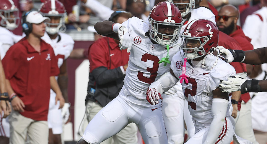 Terrion Arnold celebrates with Caleb Downs after Downs made a big play at Alabama in 2023.