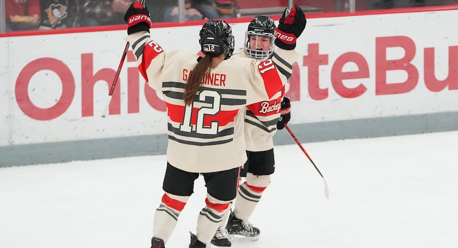 Jenn Gardiner celebrates a goal with Cayla Barnes during Ohio State’s Feb. 17 win over St. Thomas.