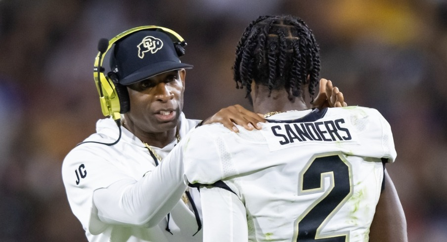 Colorado Buffaloes head football coach Deion Sanders and his son Shedeur Sanders