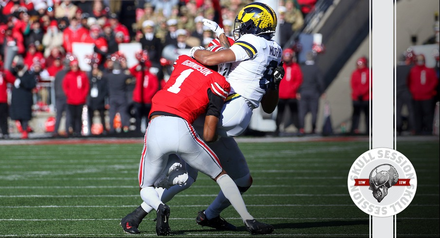Ohio State cornerback Davison Igbinosun tackling Michigan wide receiver Tyler Morris in 2024