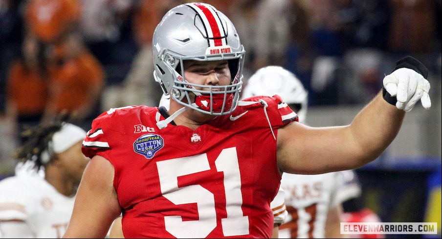 Luke Montgomery flashing the “Horns Down” during Ohio State’s 2024 Cotton Bowl win over Texas.
