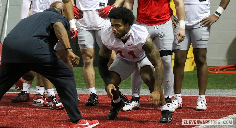 C.J. Hicks working on pass-rush drills with Larry Johnson