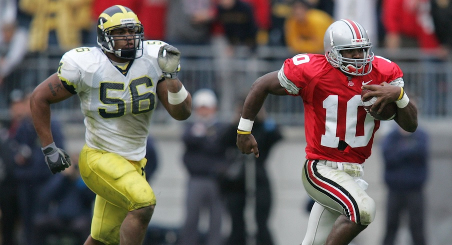 Troy Smith running away from Michigan’s LaMarr Woodley in 2004