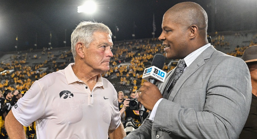 Iowa Hawkeyes head football coach Kirk Ferentz (left) interviewed by Anthony Herron (right)