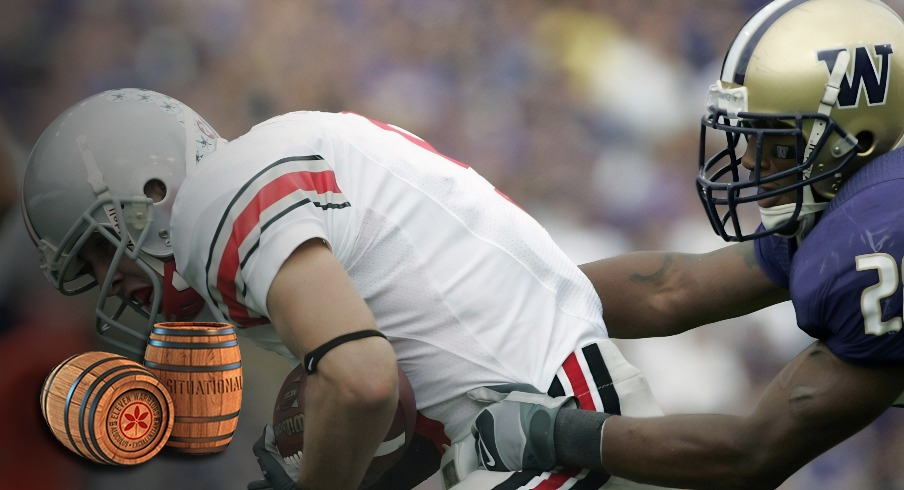 Sept 15, 2007; Seattle, WA, USA; Ohio State Buckeye wide receiver Brian Hartline (9) lunges past Washington Husky cornerback Roy Lewis (28) for the endzone to score on a 36-yard touchdown reception in the fourth quarter of the Buckeyes' 33-14 victory over the Huskies at Husky Stadium. Mandatory Credit: Joe Nicholson-Imagn Images
