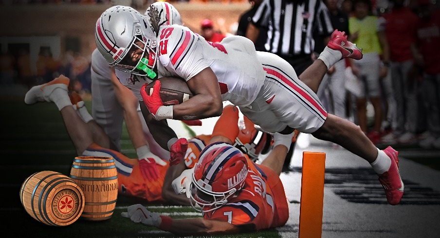 Ohio State Buckeyes running back Bo Jackson (25) scores a touchdown over Illinois Fighting Illini defensive back Matthew Bailey (7) during the first half of the NCAA football game at Gies Memorial Stadium in Champaign on Oct. 11, 2025.