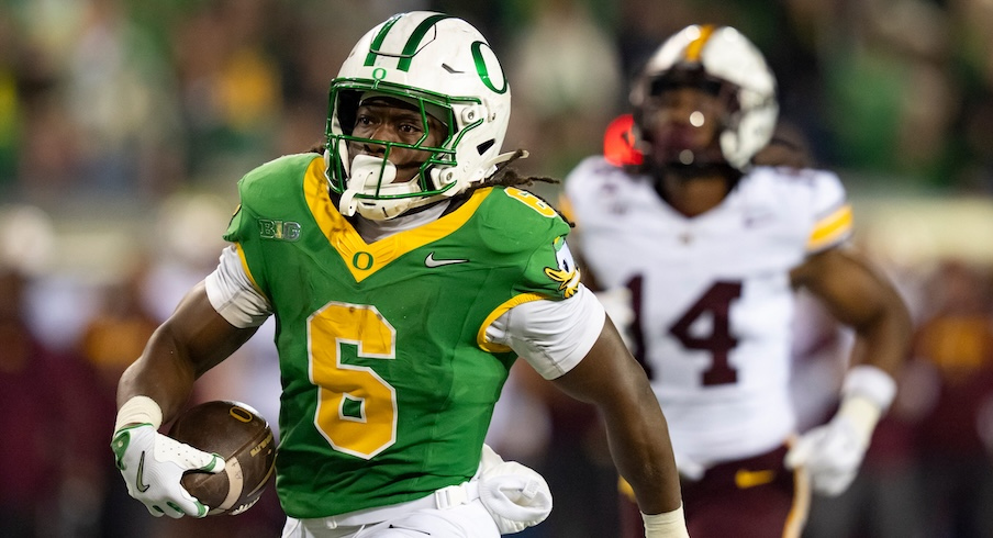 Oregon’s Noah Whittington scoring a touchdown vs. Minnesota