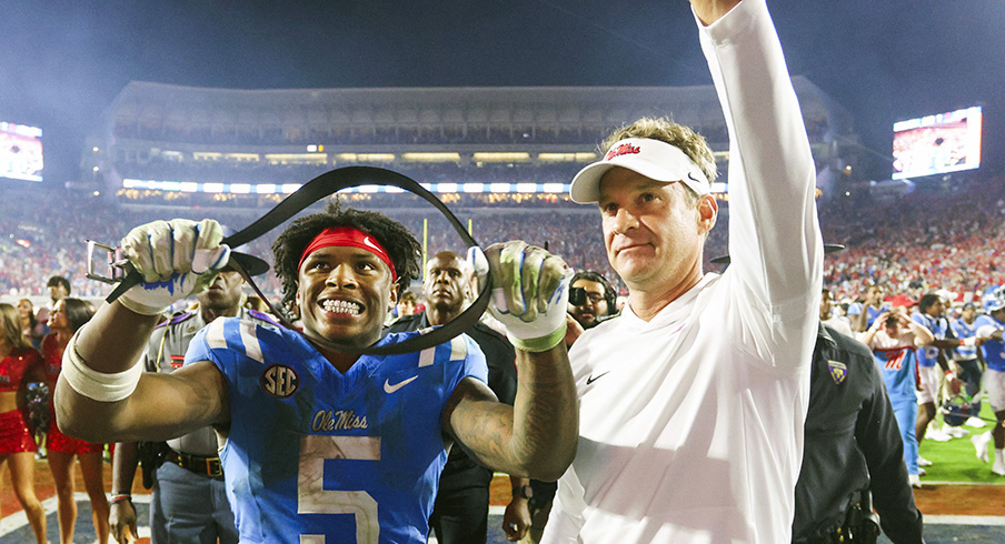Mississippi Rebels running back Kewan Lacy (5) and head coach Lane Kiffin react after defeating the Florida Gators