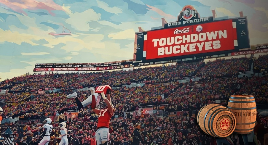 austin siereveld lifts up julian sayin after an ohio state touchdown against penn state in 2025