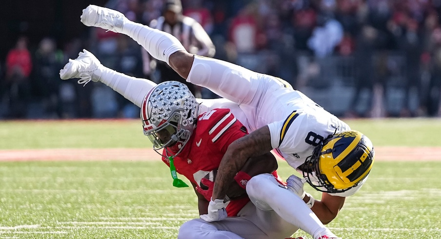 Caleb Downs intercepting a pass vs. Michigan in 2024