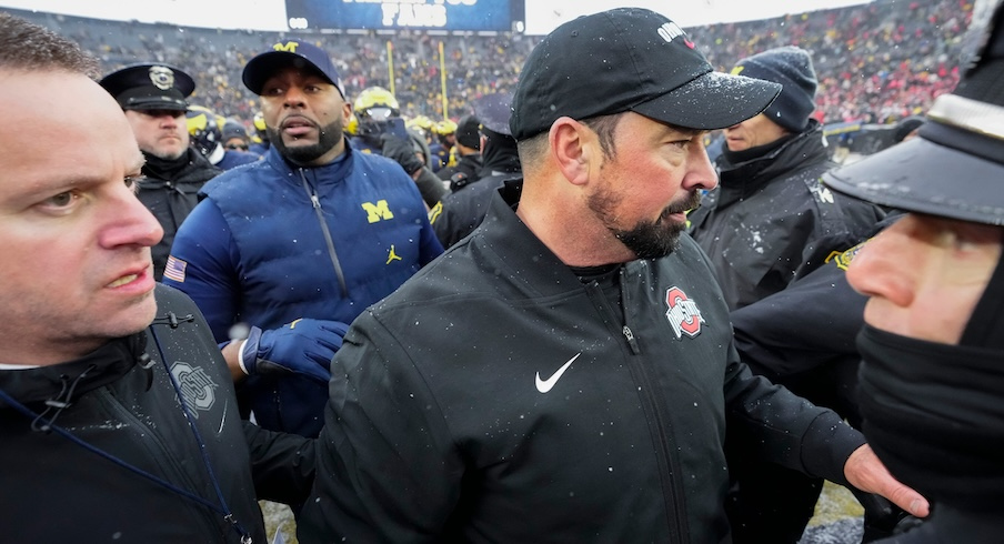 Ryan Day and Sherrone Moore on the field after the game