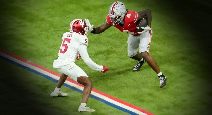 Ohio State Buckeyes wide receiver Jeremiah Smith (4) looks to move past Indiana Hoosiers defensive back D'Angelo Ponds (5) on Saturday, Dec. 6, 2025, during the Big Ten football championship at Lucas Oil Stadium in Indianapolis