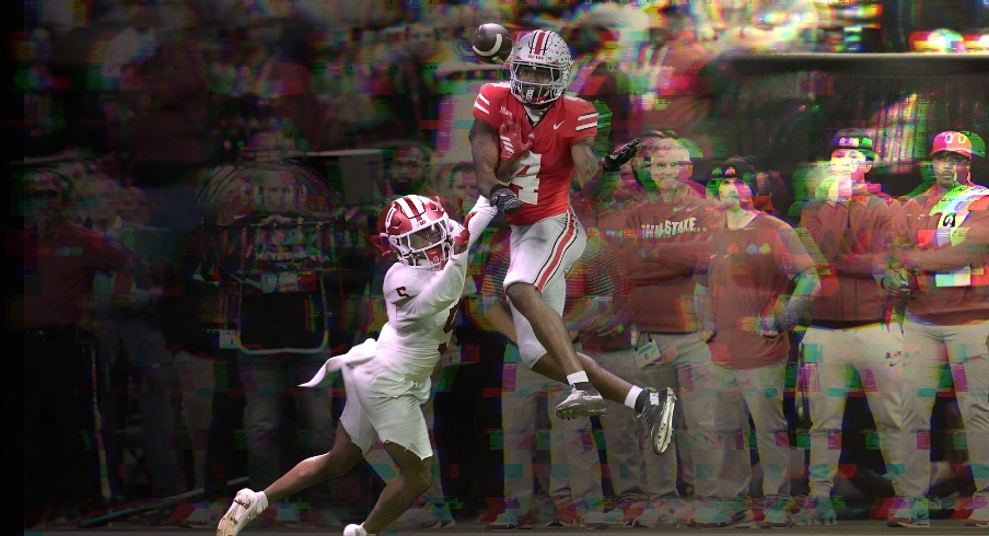 Ohio State Buckeyes wide receiver Jeremiah Smith (4) catches a pass in front of Indiana Hoosiers defensive back D'Angelo Ponds (5) on Saturday, Dec. 6, 2025, during the Big Ten football championship at Lucas Oil Stadium in Indianapolis.