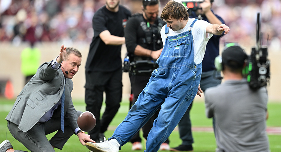 A fan kicks a field goal before the Texas A&M and Miami game