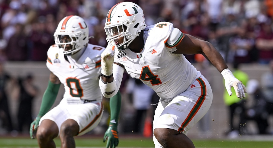 Rueben Bain Jr. (4) and Keionte Scott (0)