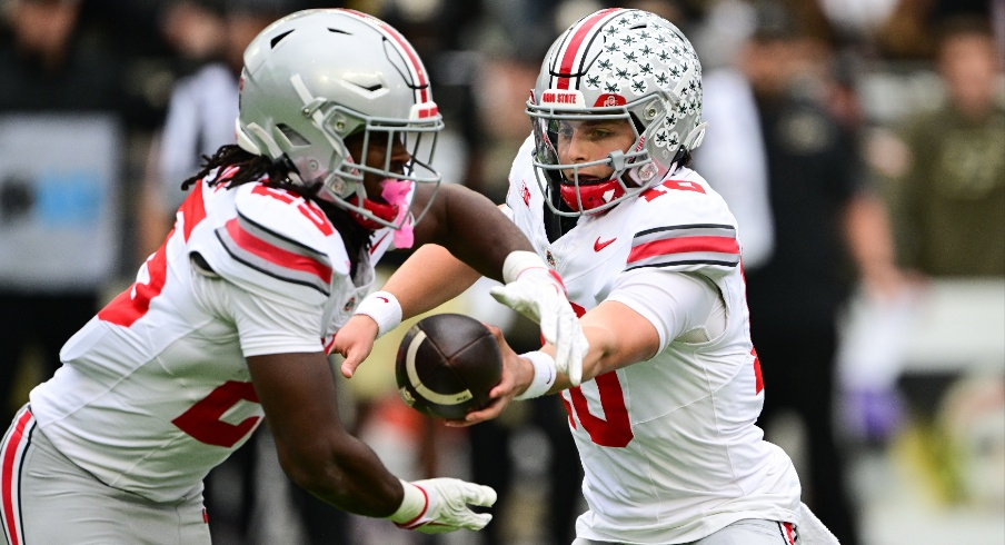 Julian Sayin hands the ball off to Bo Jackson