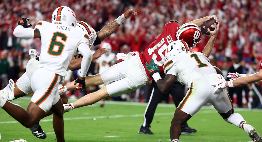 Fernando Mendoza diving for a touchdown vs. Miami in the national championship game