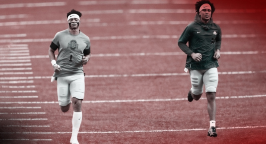 Jan 1, 2021; New Orleans, LA, USA; Ohio State Buckeyes quarterback Justin Fields (1) and quarterback C.J. Stroud (14) warm up prior to the College Football Playoff semifinal against the Clemson Tigers at the Allstate Sugar Bowl in the Mercedes-Benz Superdome in New Orleans on Friday, Jan. 1, 2021. Mandatory Credit: Adam Cairns-Imagn Images