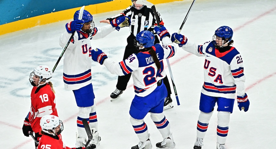 Joy Dunne celebrates with U.S. teammates