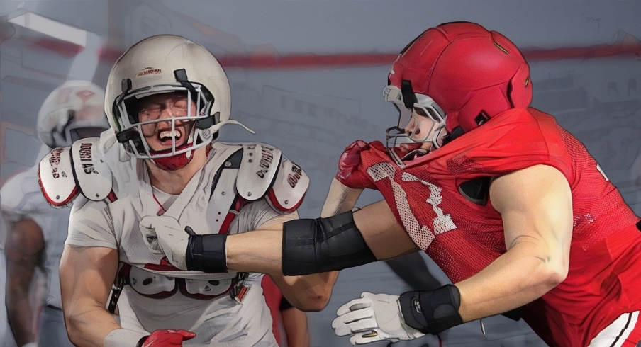 Ohio State Buckeyes defensive end Beau Atkinson (12) fights past defensive tackle Sam Greer (77) during Student Appreciation Day spring practice at the Woody Hayes Athletic Center on April 4, 2026.