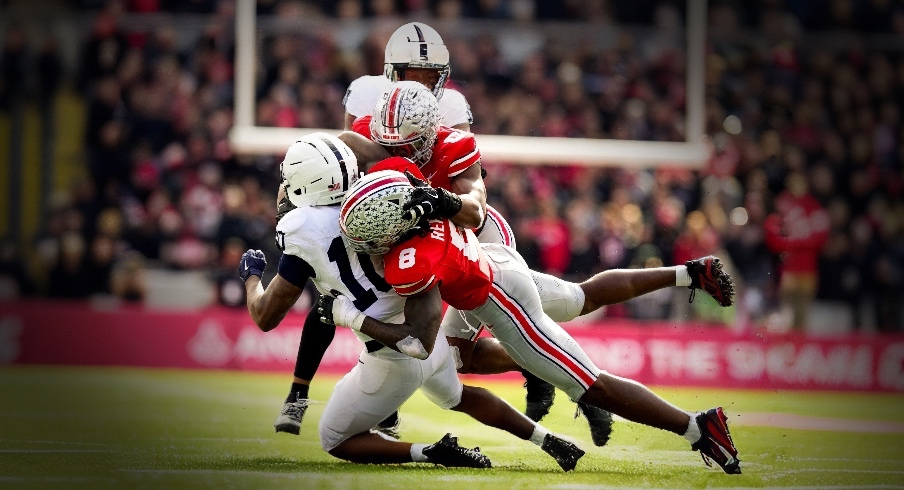 Ohio State Buckeyes linebacker Arvell Reese (8) and linebacker Sonny Styles (0) tackle Penn State Nittany Lions running back Nicholas Singleton (10) in the second half of the college football game at Ohio Stadium on Saturday, Nov. 1, 2025 in Columbus, Ohio.