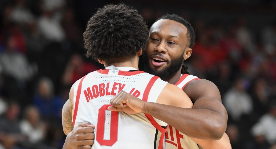 John Mobley Jr. and Bruce Thornton hug