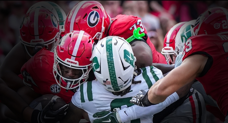 Nov 22, 2025; Athens, Georgia, USA; Georgia Bulldogs running back Nate Frazier (3) runs over Charlotte 49ers defensive back Randy Franklin (0) for a touchdown during the first quarter at Sanford Stadium. Mandatory Credit: Dale Zanine-Imagn Images