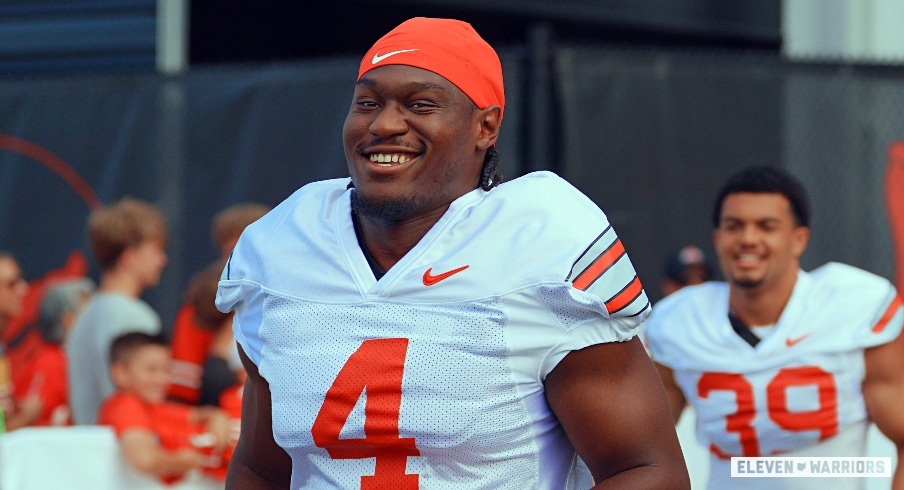 Ohio State defensive end Qua Russaw reacts after fans think he's Jeremiah Smith
