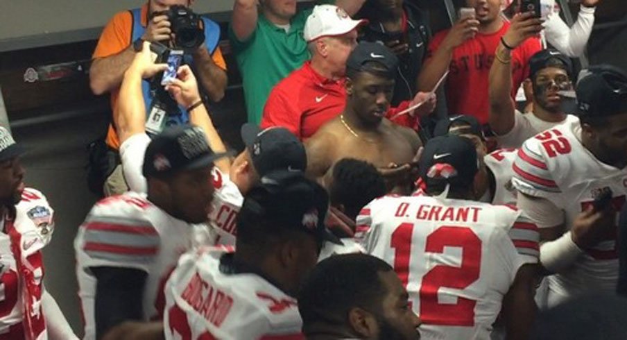 Ohio State's Doran Grant gets down to Shy Glizzy in the locker room after the Buckeyes 42–35 win over Alabama in the Sugar Bowl.